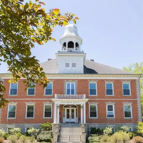 Front view of Fancher Hall, a historic brick building at Houghton College, with steps leading to the main entrance